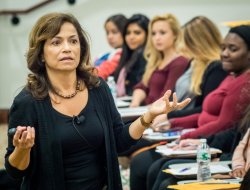 female Professor lecturing to students