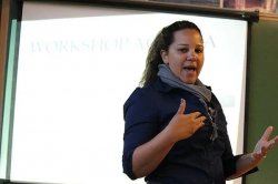 Photo of Dr. Courtney Plotts presenting at a conference