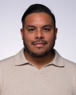 Felix smiling for headshot.