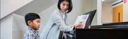 piano teacher with student