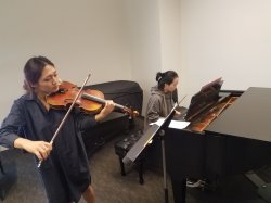 Violin and piano students practicing