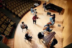 Workshop with Pathways program students on stage from above.