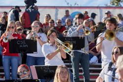 The Pep Band performing in the stands at the football game