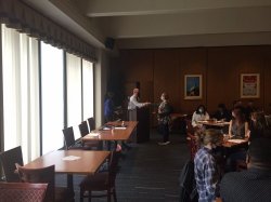 Woman shaking hands with man in dining room