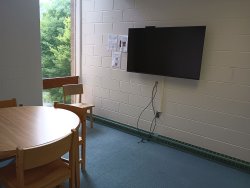 Table and chairs with monitor