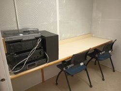 Soundproof room with record player and speaker