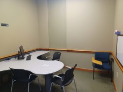 Study room with table, chairs, and whiteboard