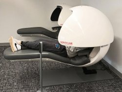 student lying in nap pod