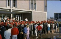 a large crowd of students wearing dink hats