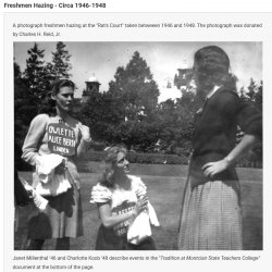 Two students wearing dink hats talking to a upperclassman