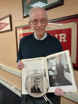 leon zimmerman with his yearbook opened to his senior photo