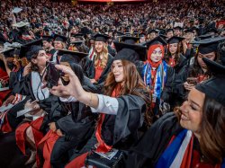 a crowd of graduating students in modern day