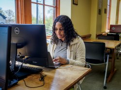 student sitting at a computer