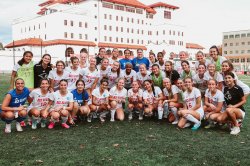 Women's soccer team posing for group photo on Montclair campus