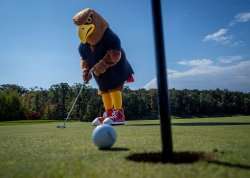 Rocky the Red Hawk on golf course