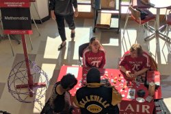 students talking to incoming freshman at the mathematics table at Accepted Students Day