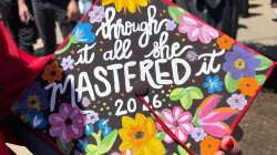 graduation cap with flowers painted on it