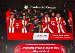 graduating students on big screen during commencement
