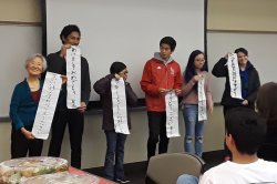 Students learning Asian Caligraphy