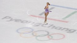Student Isadora Williams mid-jump on the ice at the PyeongChang Olympics