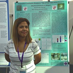 Graduate Student Erika Bernal in front of her research poster on Zooplakton Community Structure - a "Tale of Two" New Jersey Estuaries