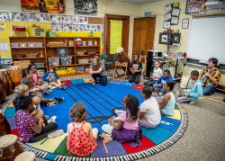 Monika Szumski leads West African music circle with third graders at Seth Boyden Elementary School