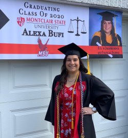 Alexa Bufi poses with the banner her family created. Photo courtesy of the family.