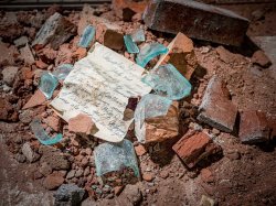 Letter surrounded by broken glass