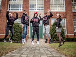 quintuplets jumping outside high school