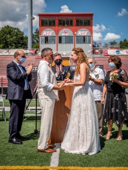 alumni wed on the fifty-yard-line of the football field