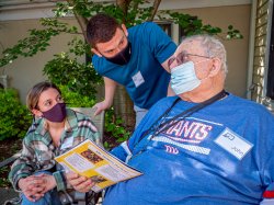 Christina Chagaris and Gregory Carmona, Nutrition and Food Science majors, meet their video pal John Zbozen Jr. at Canterbury Village Assisted Living.