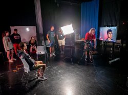 Journalism students setting up a sound stage for a remote interview