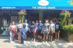 Italian summer students pose for a photo in front of The Greene Grape