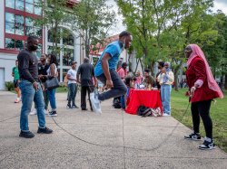 Student jumping rope on campus