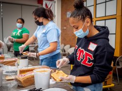 volunteer students preparing sandwiches