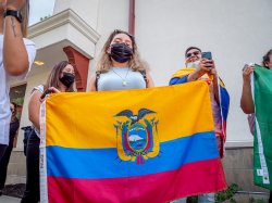 student holding Haitian flag