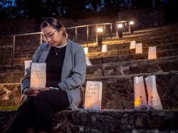 Student holding a luminaria