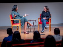 Tracie Strahan speaking with Bobbi Brown on stage