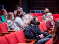 Attendees seated in the theater