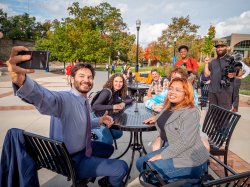 President Koppell takes a selfie with students