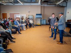 Marsalis speaking to students at a brass master class