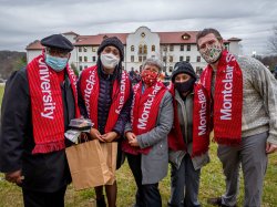 group of five attendees wearing Montclair State University scarves