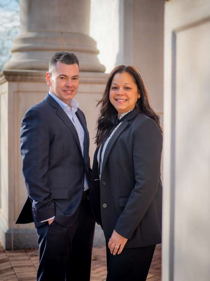 Pauline and Robert Reid standing together outside on the campus of Montclair State University
