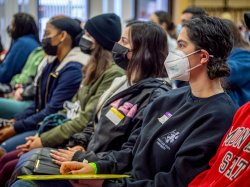 Jess Kershenblatt seated alongside other students