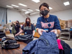 Volunteers organize donations at the Father English Community Center