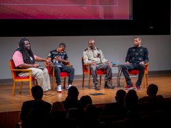 Jason Williams reaches out to Rayshawn Brown, who was emotional recounting the night 23 years ago that he and the other panelists were shot by police during a traffic stop.