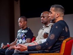 Danny Reyes, foreground, speaks while Jarmaine Grant, center, and Rayshawn Brown listen