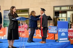 Alexander Ng receives his pin during the ceremony