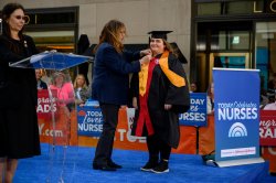 Student receiving their pin during the ceremony