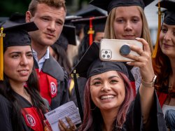 group of graduates posing for selfie